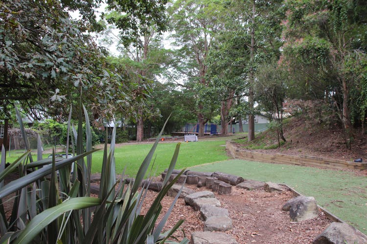 A view of Normanhurst Public School grounds showing some grass and plants.