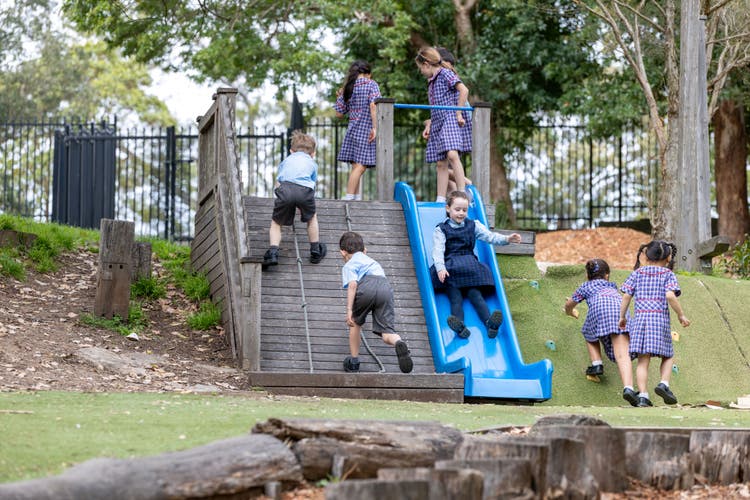 A group of students playing in the school grounds.